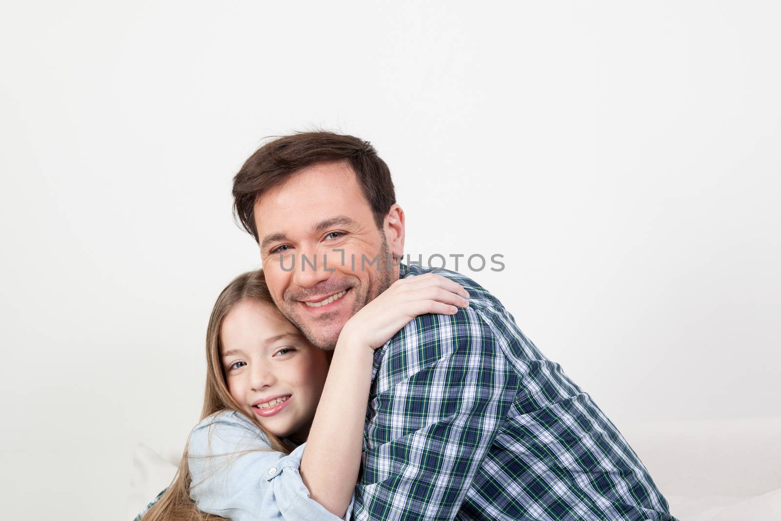 Father and daughter giving himself a hug