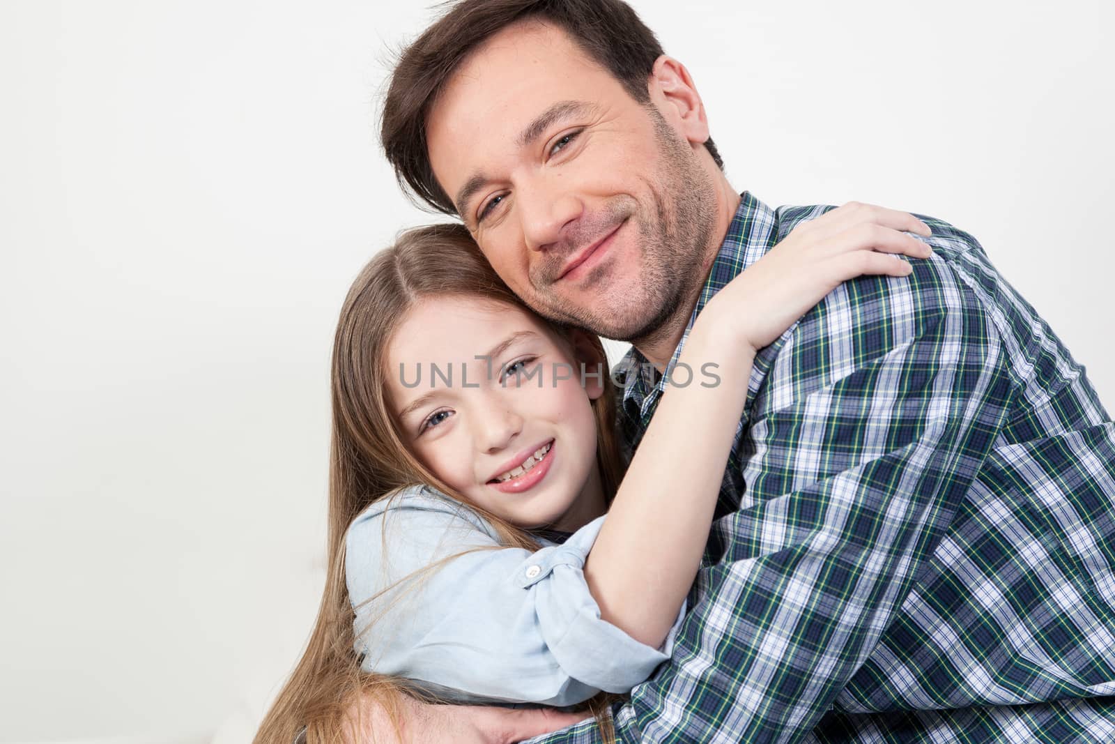 Father and daughter giving himself a hug