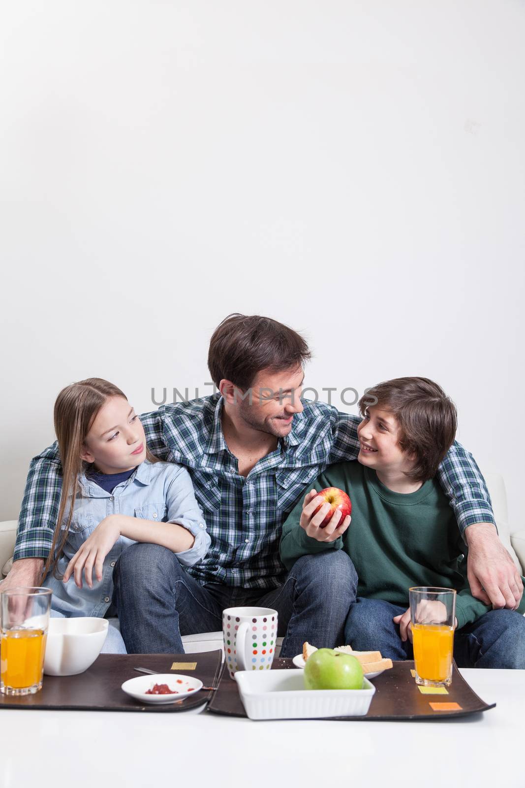 Man having a breakfast with your two childrens