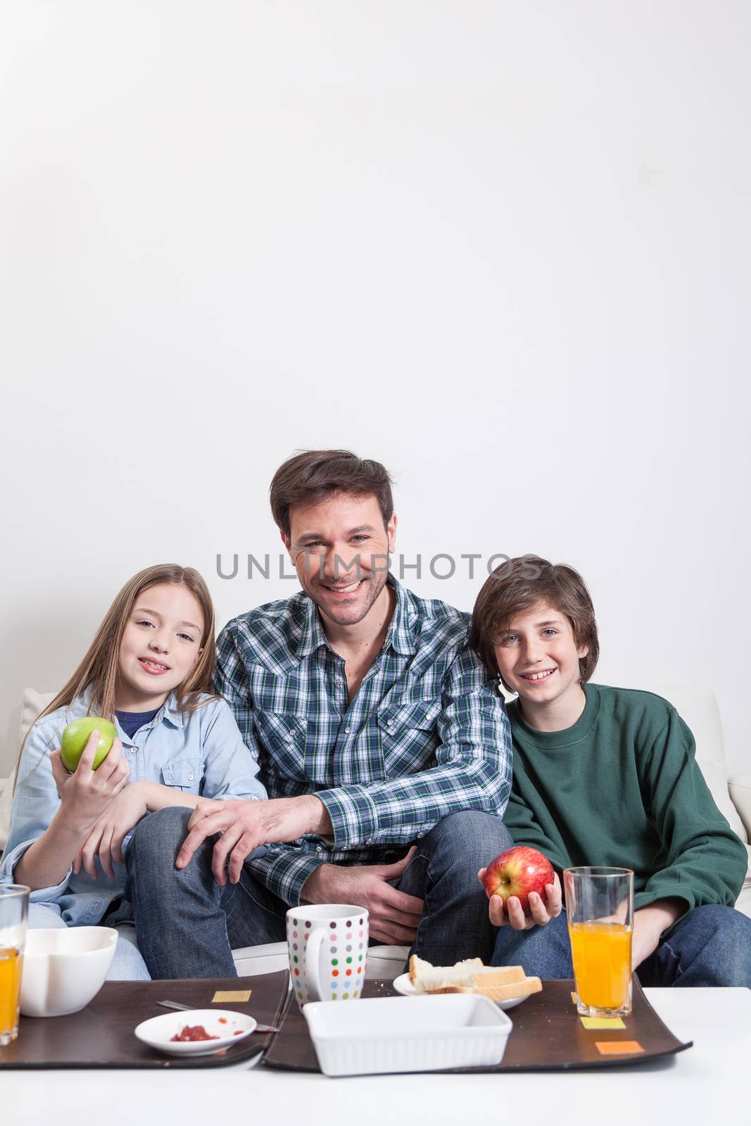 Man having a breakfast with your two childrens