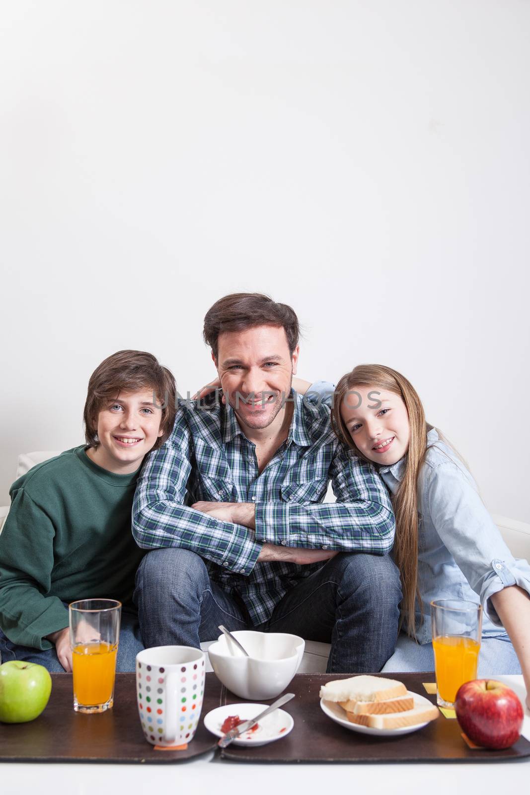 Man having a breakfast with your two childrens