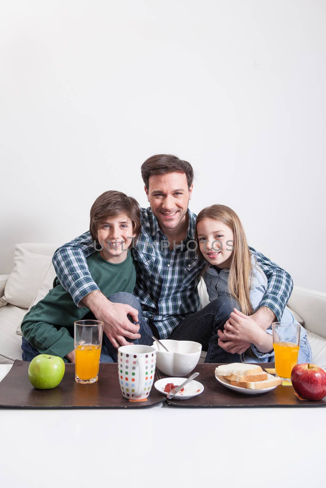 Man having a breakfast with your two childrens by ifilms