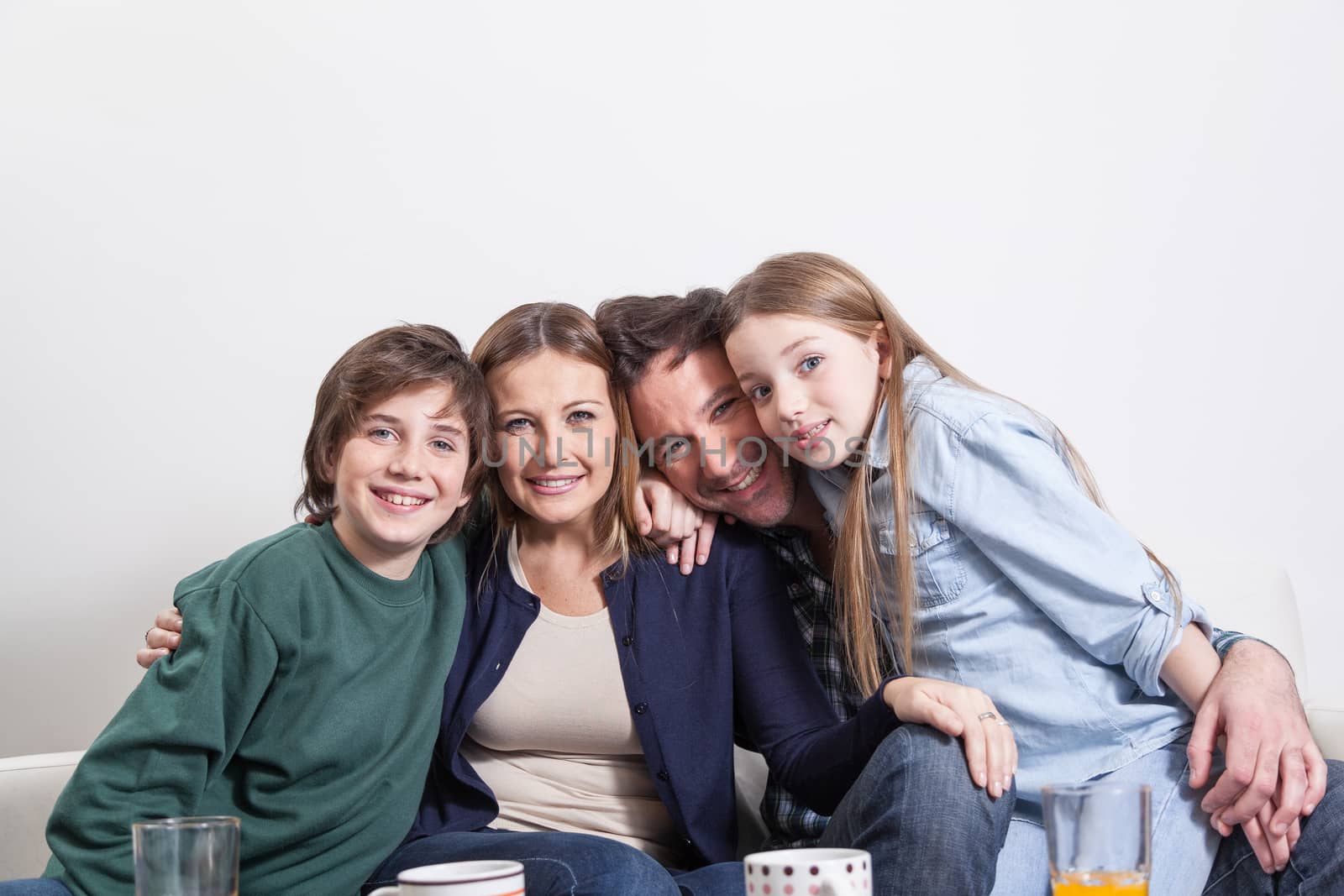 Happy couple with your childrens sitting