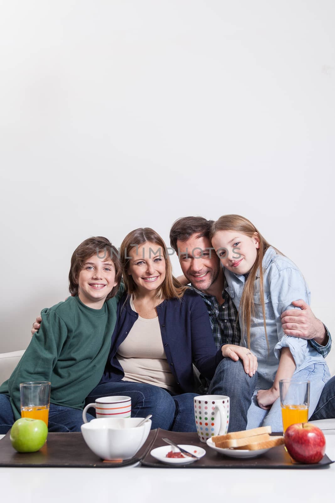 Happy couple with your childrens sitting