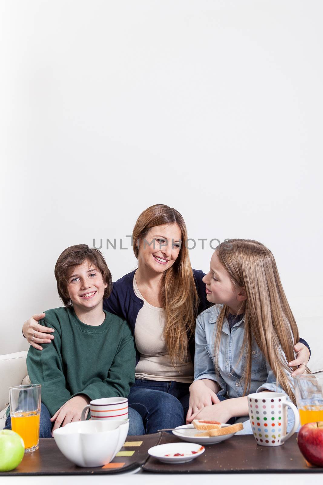 Happy family sitting in the couch