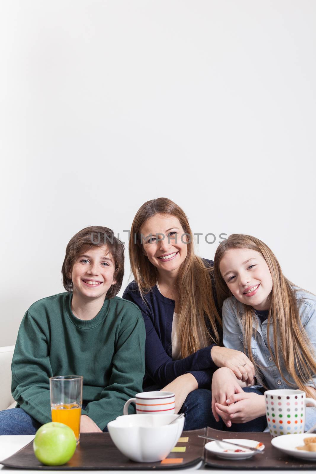 Happy family sitting in the couch