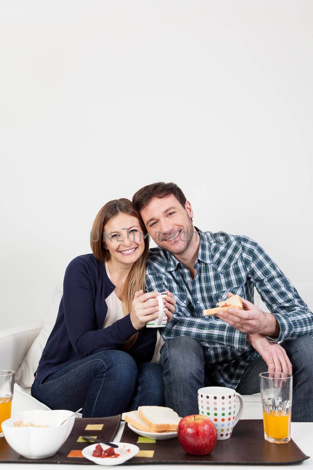 Couple smiling having a breakfast