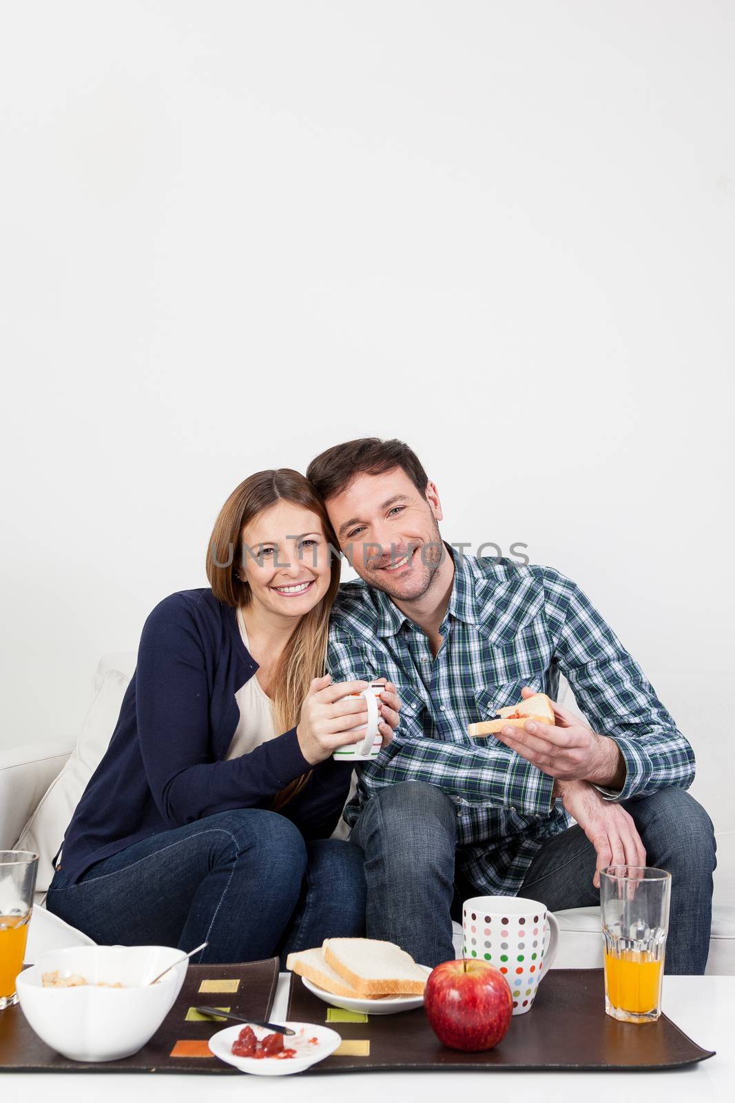 Couple smiling in breakfast