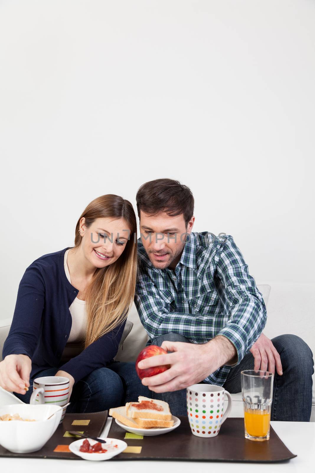 Couple smiling in breakfast
