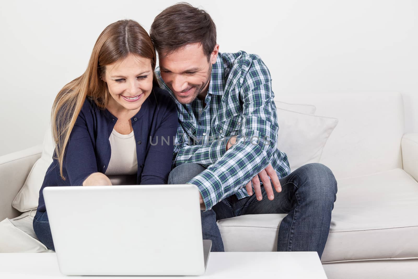 Couple using the computer
