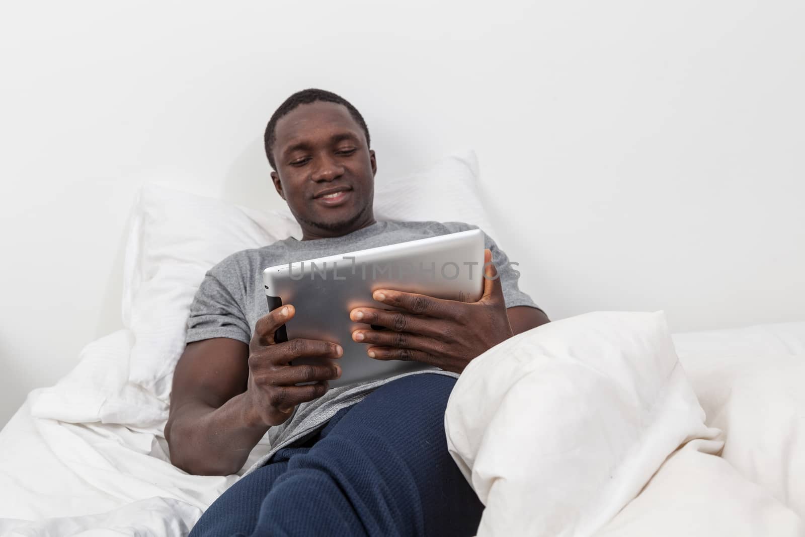 Man looking at his tablet