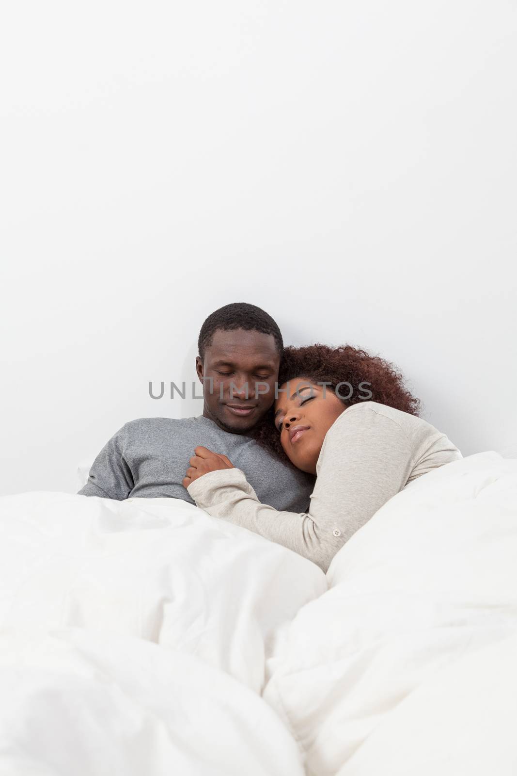 African couple sleeping