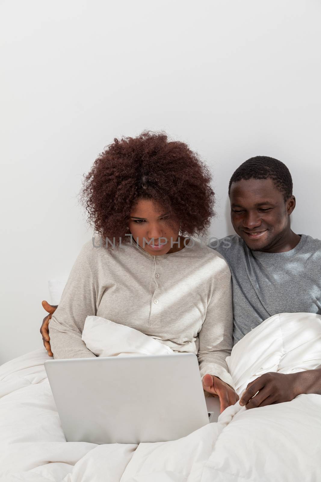 Black couple in love using the computer