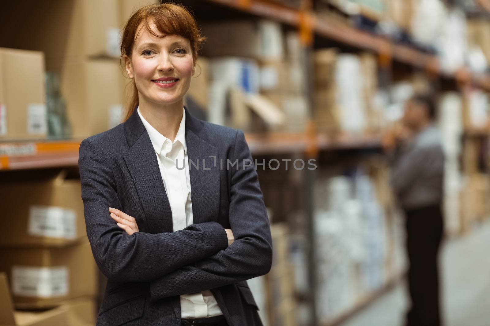 Female manager with arms crossed by Wavebreakmedia