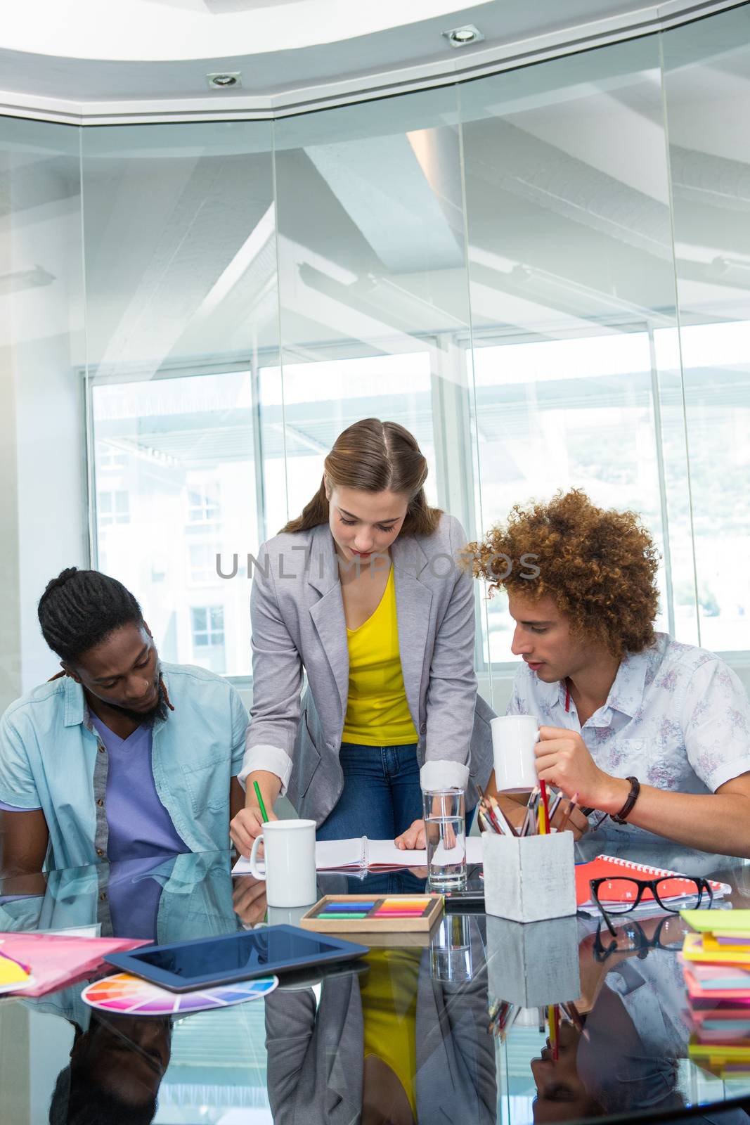 Creative young business people working at office desk