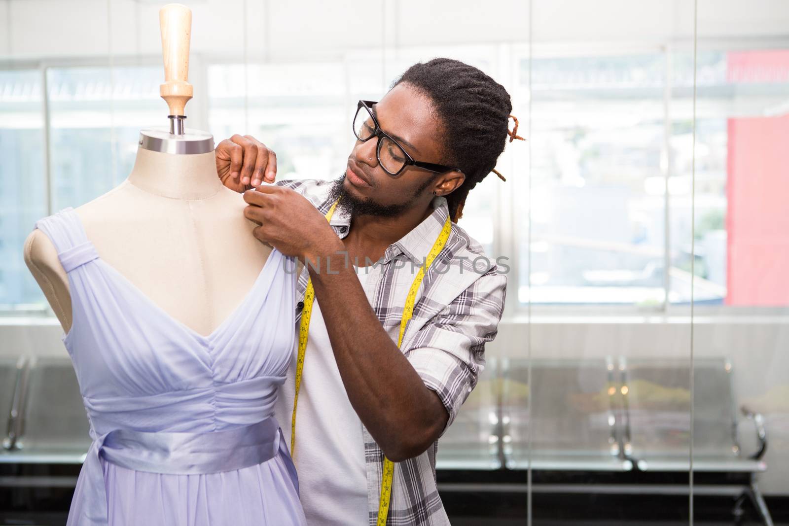 View of male fashion designer and mannequin