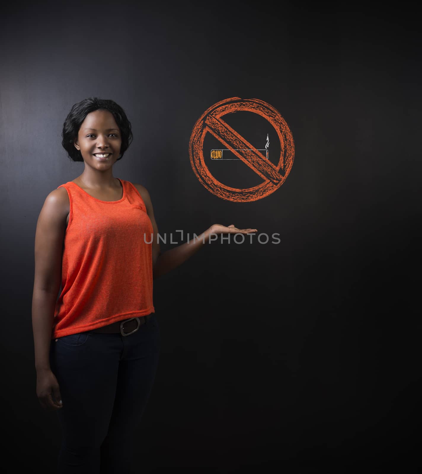 No smoking tobacco South African or African American woman on blackboard background by alistaircotton