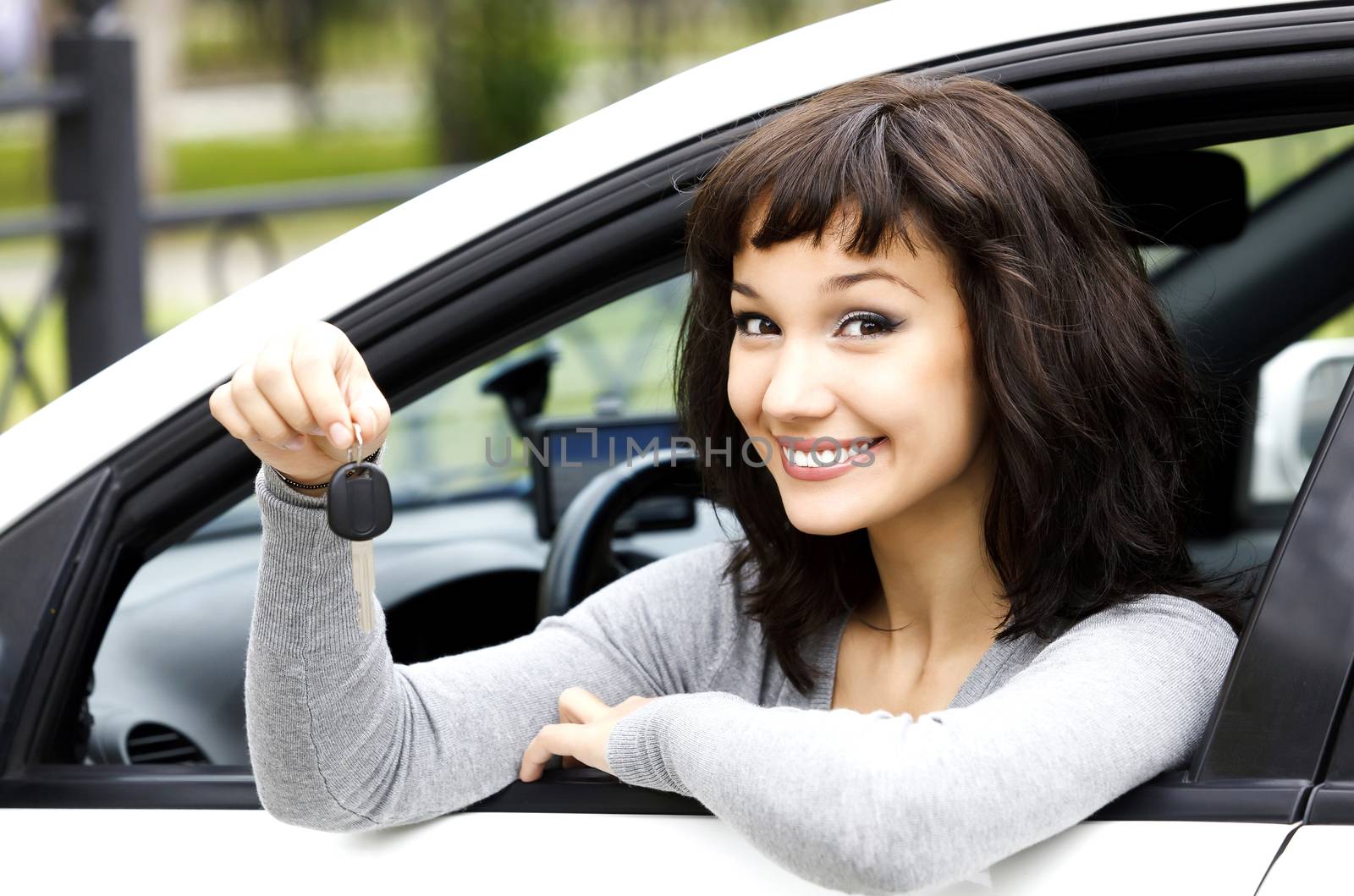 Pretty girl showing the car key