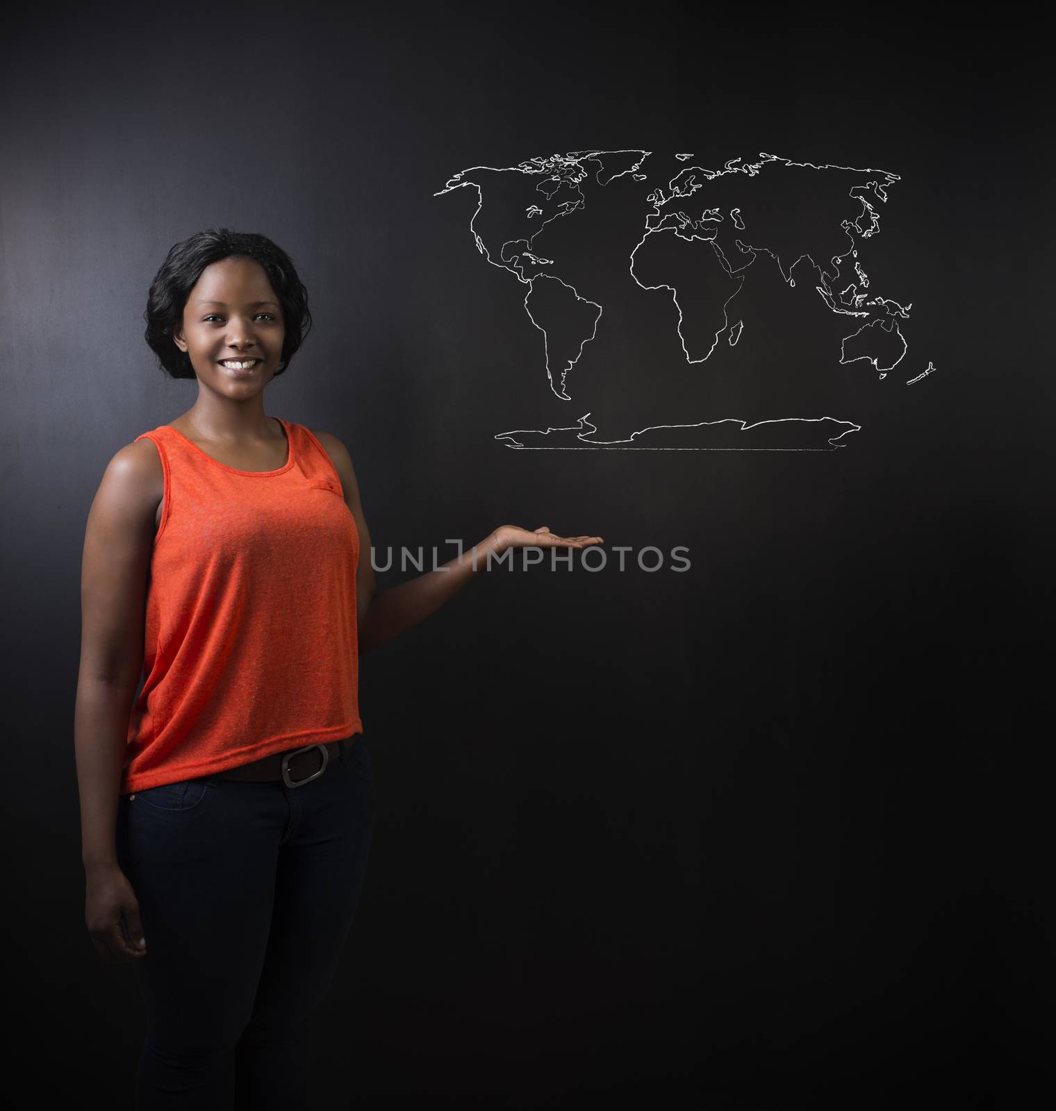 South African or African American woman teacher or student with world geography map chalk on background by alistaircotton