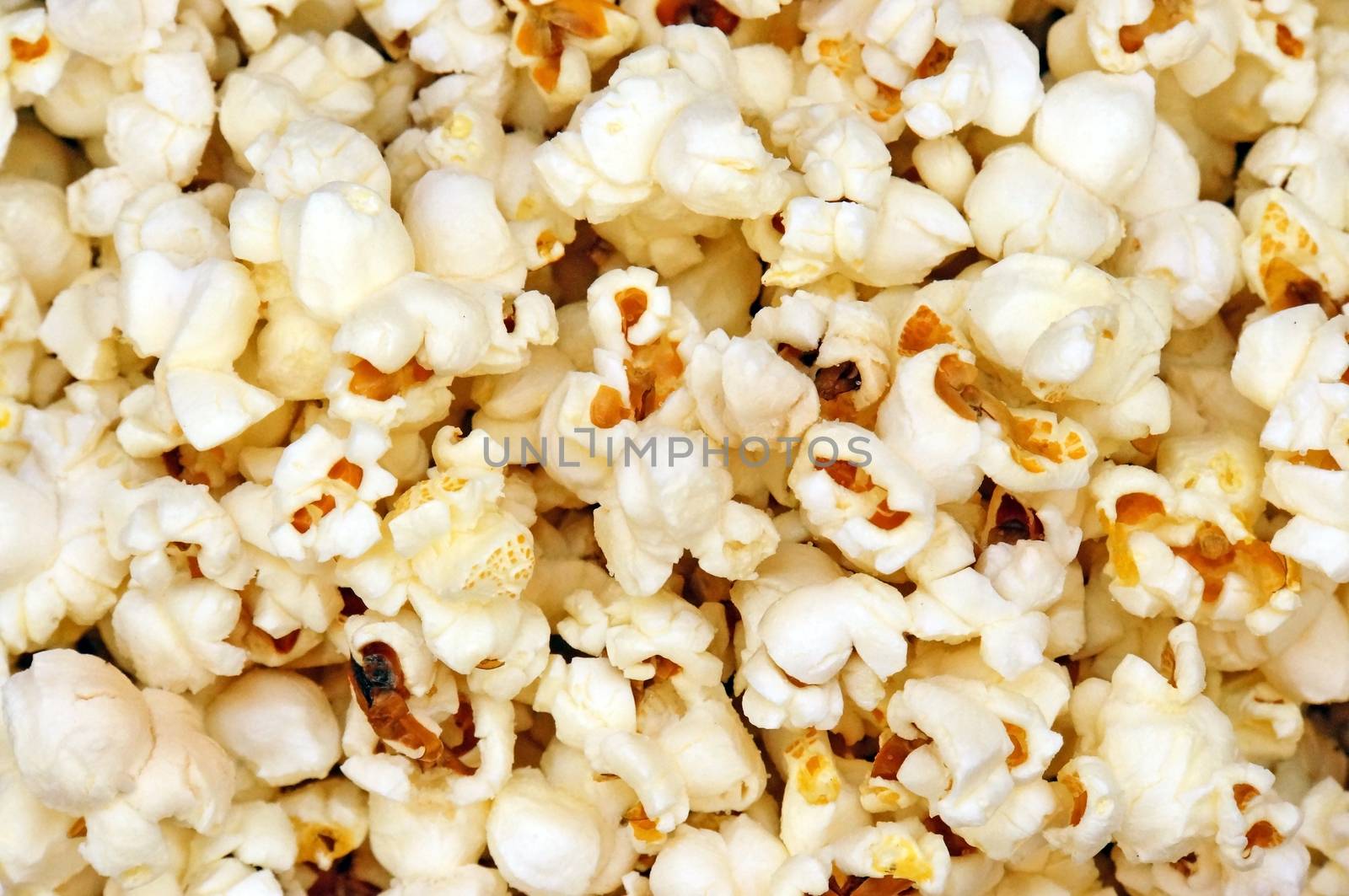 Popcorn close up as a background by Chiffanna