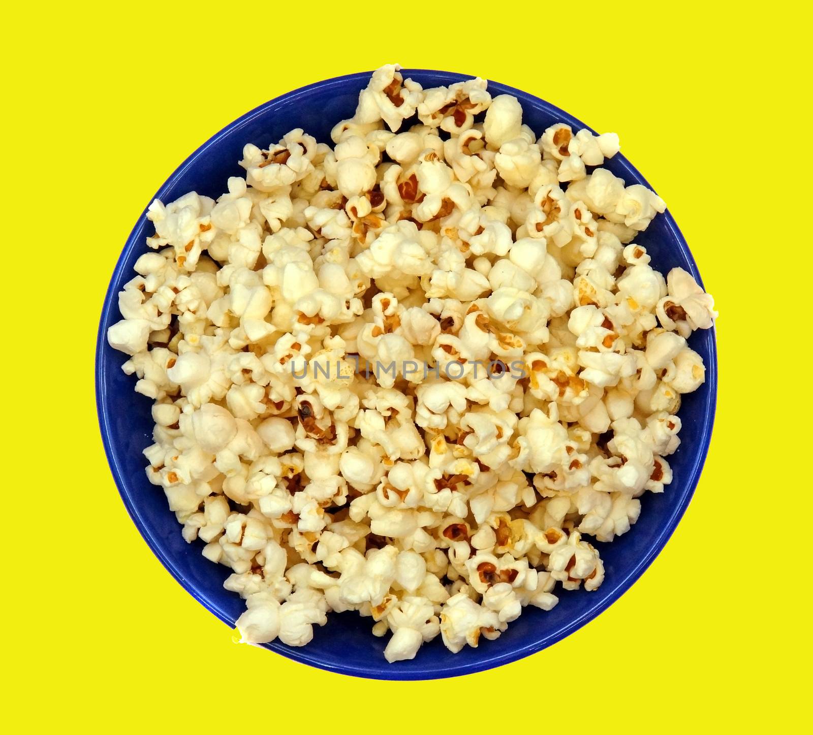 Popcorn in a blue plate closeup