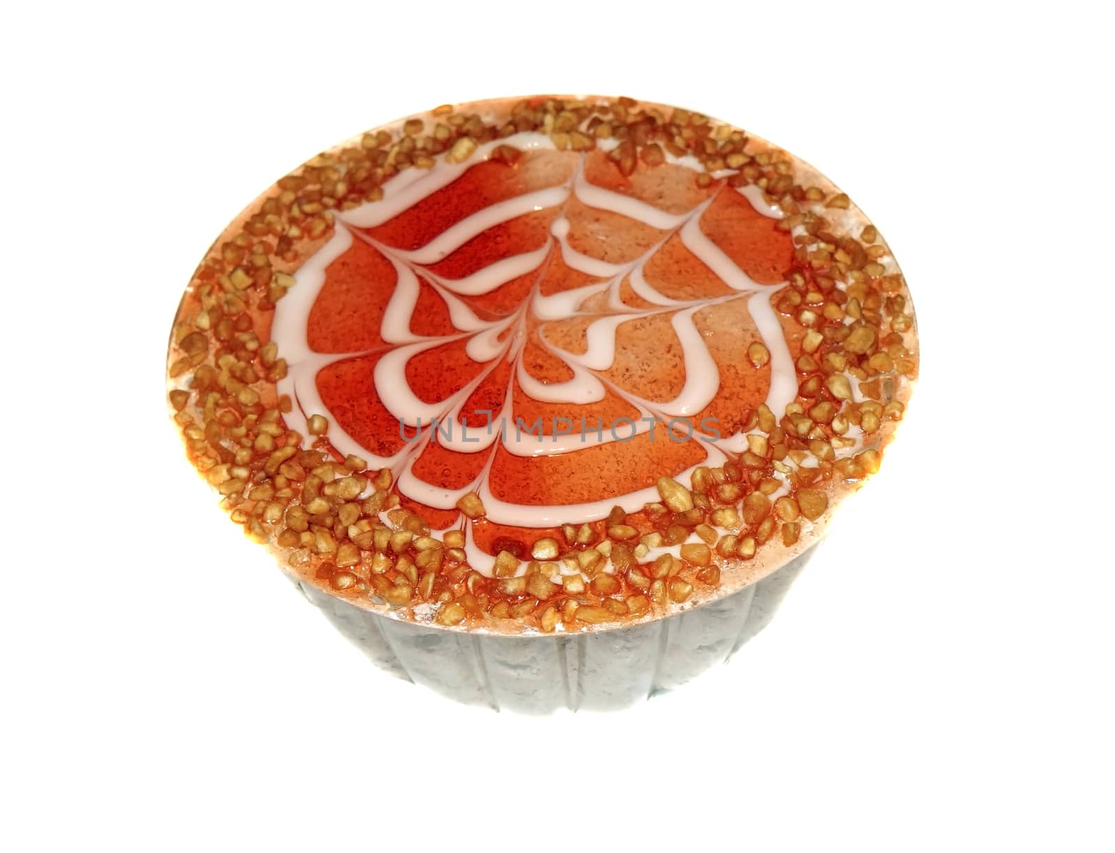 Cake decorated with red berry jelly and crushed nuts isolated                              