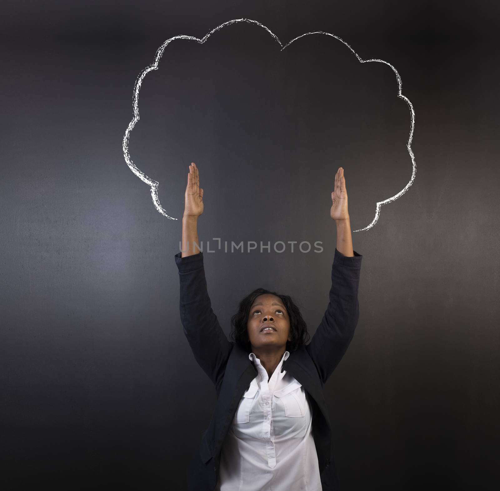South African or African American woman teacher or student reaching for the sky as a chalk tree growth concept against a blackboard background