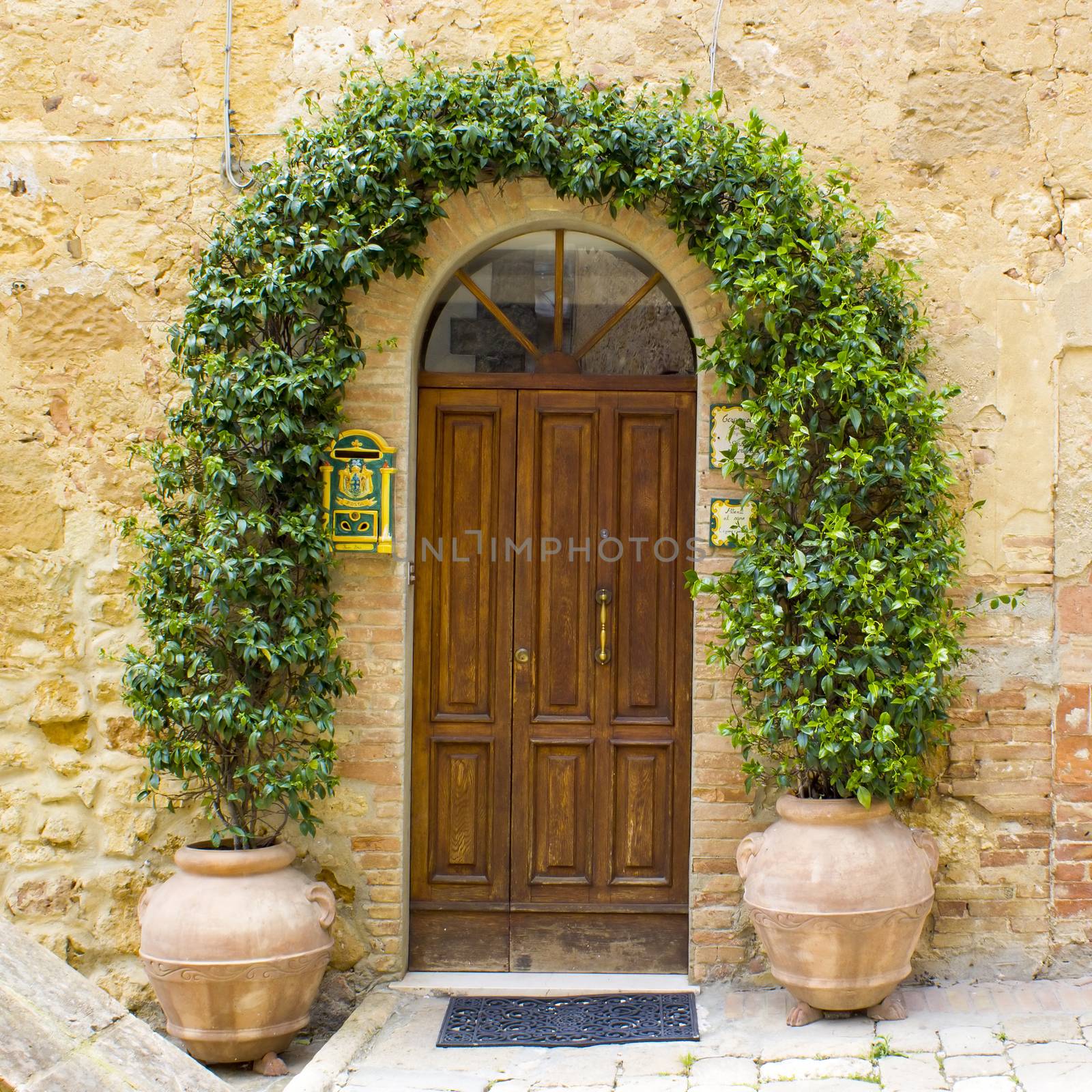 Doors from the medieval town Pienza in Italy by miradrozdowski