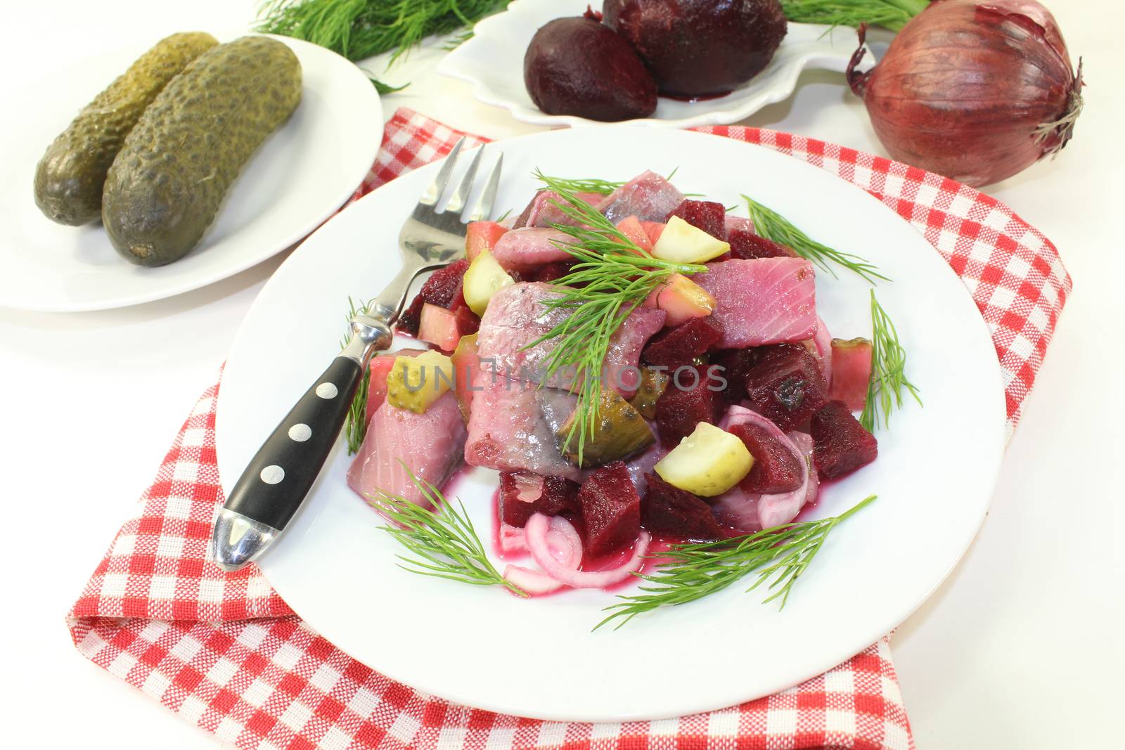 Matie salad with beetroot, onions and pickles