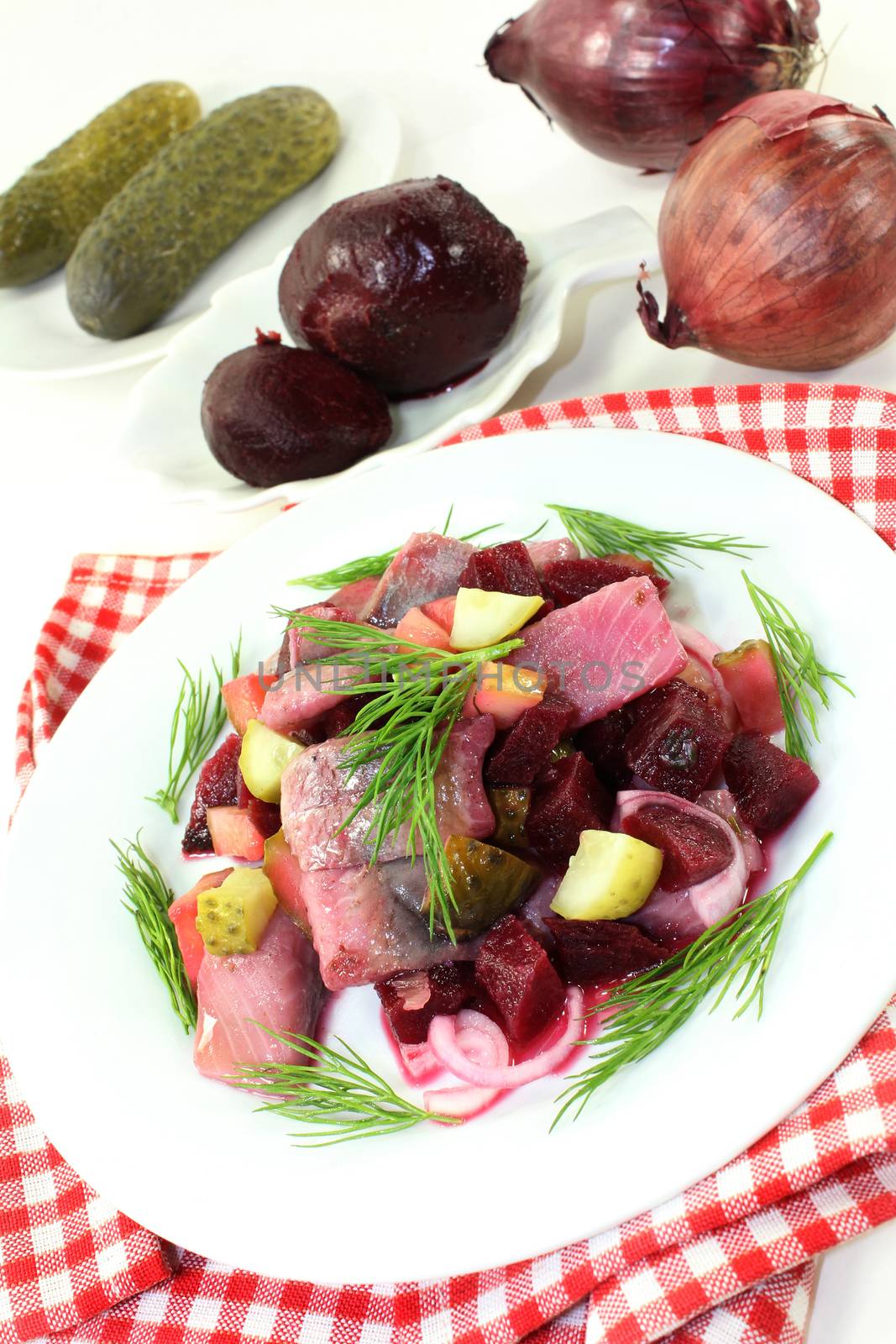 Matie salad with beetroot, onions and pickles