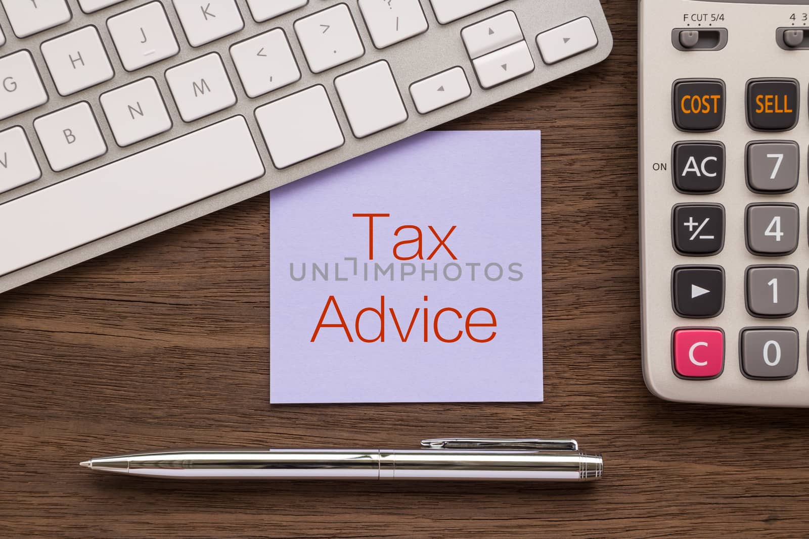 Notepad with words " Tax Advice " putting on workspace by vinnstock