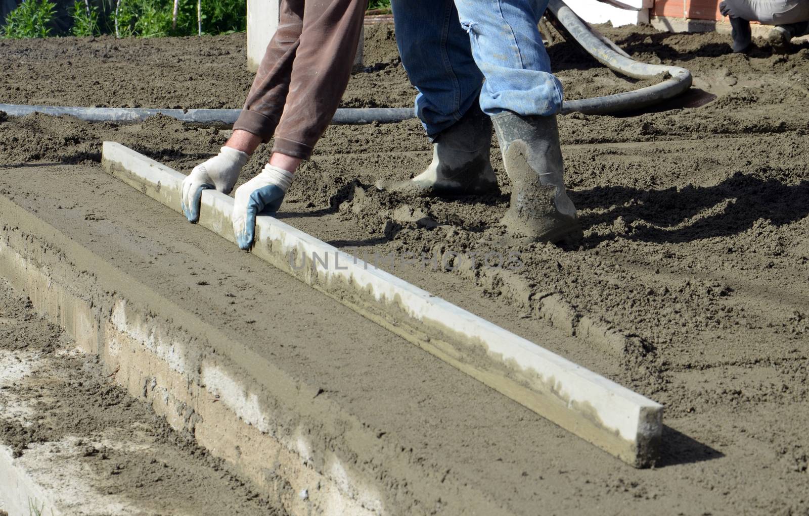 Picture of a workers smooth concreting the floor