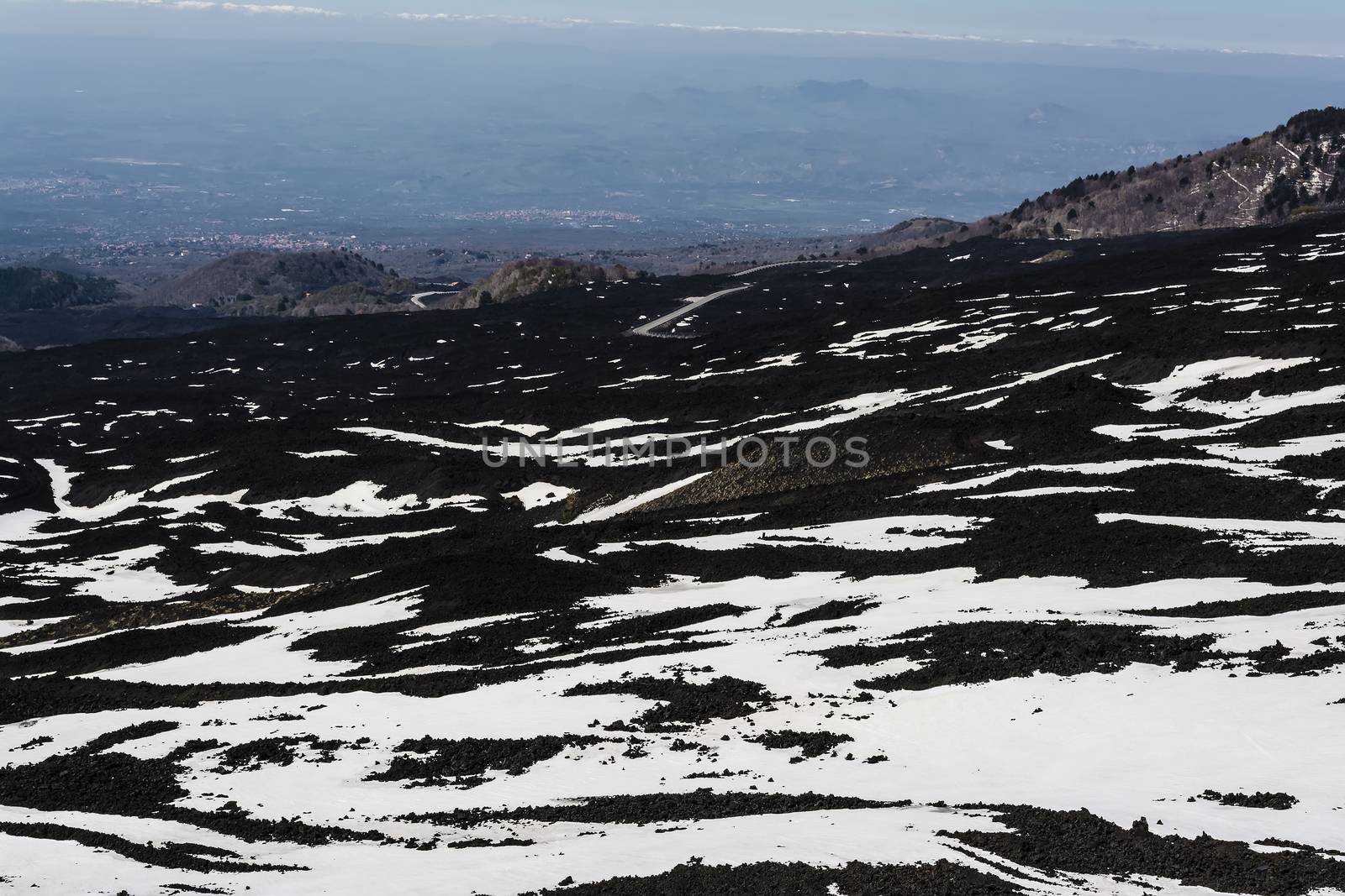 Etna mountain landscape, volcanic rock and snow, Sicily, Italy
