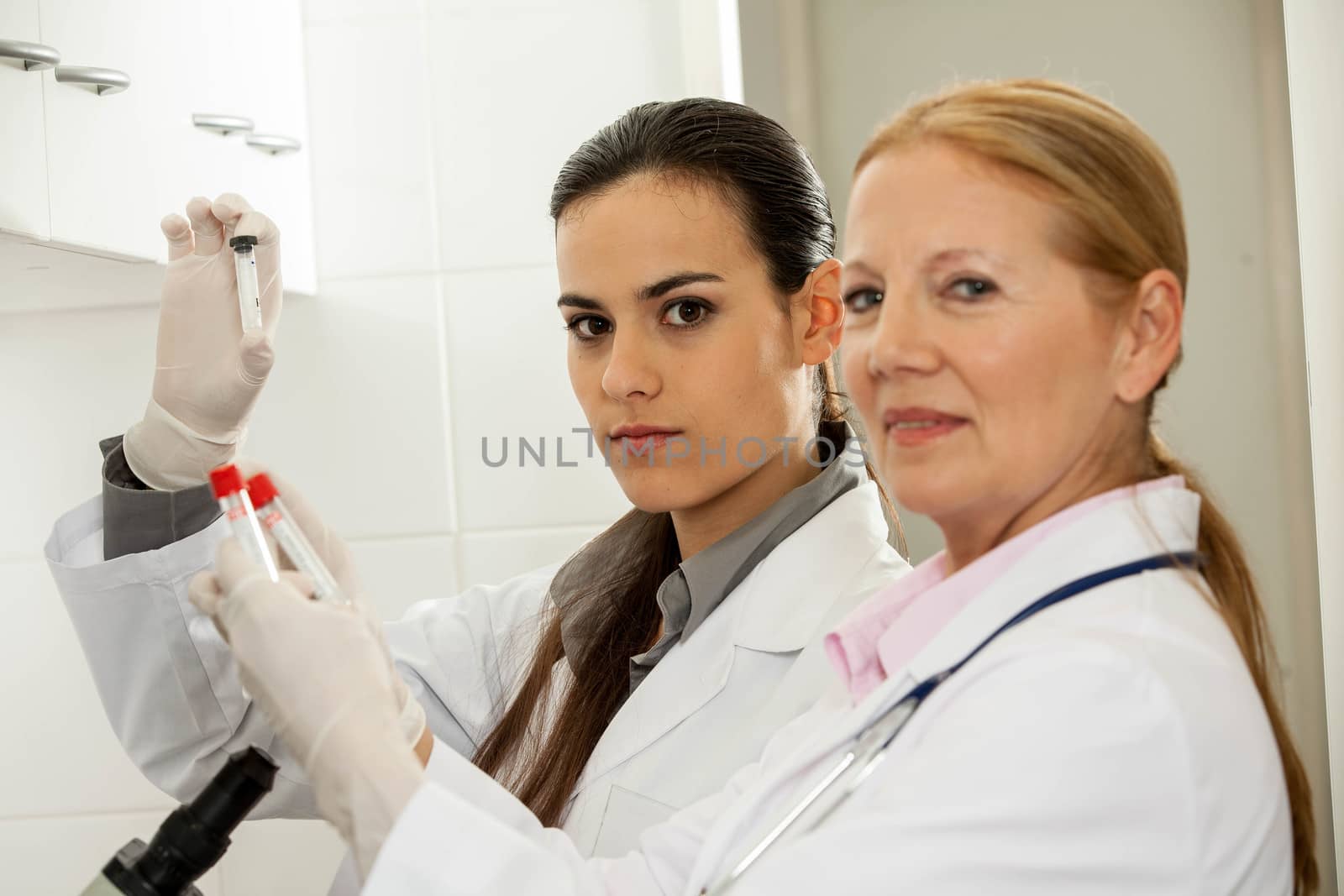 couple in a lab looking at the camera