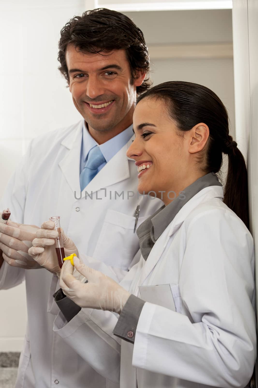 partners smiling in a lab by ifilms