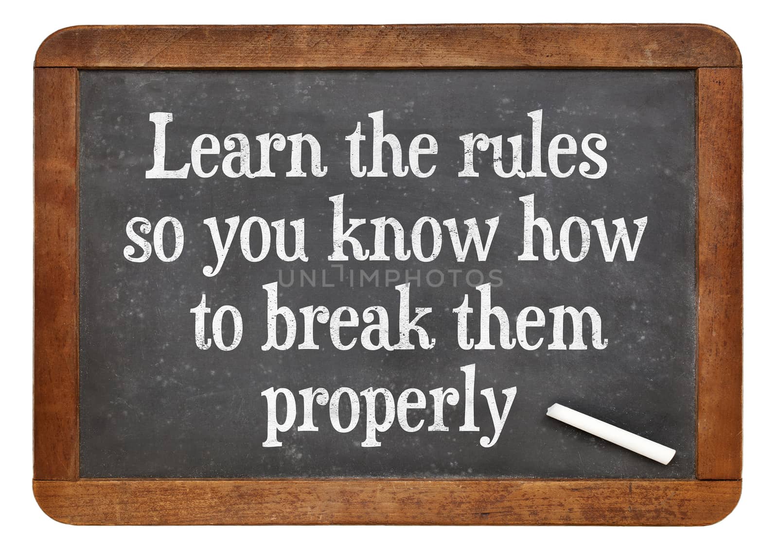 Learn the rules, so you know hot to break them properly. INspirational words on a vintage slate blackboard