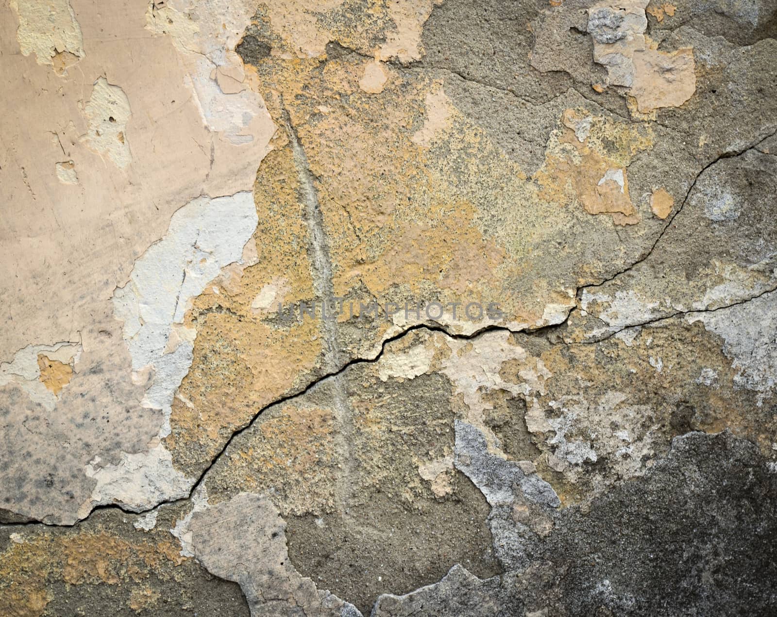 abstract background or texture old plaster fallen off a color