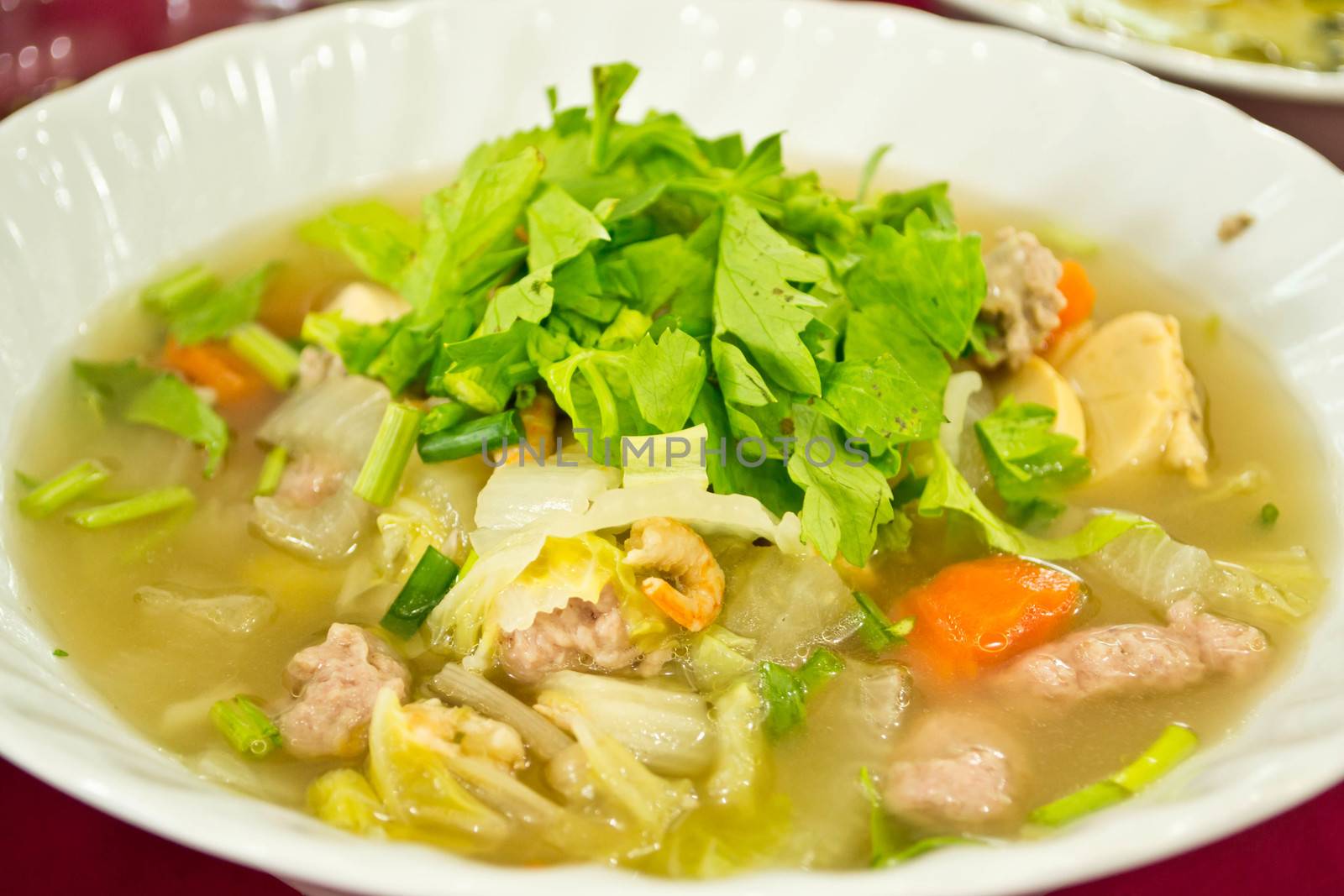 A bowl of hot Broth or Vegetable Soup