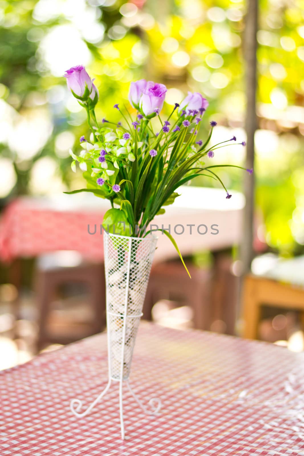  Beautiful flower in a vase on wooden table