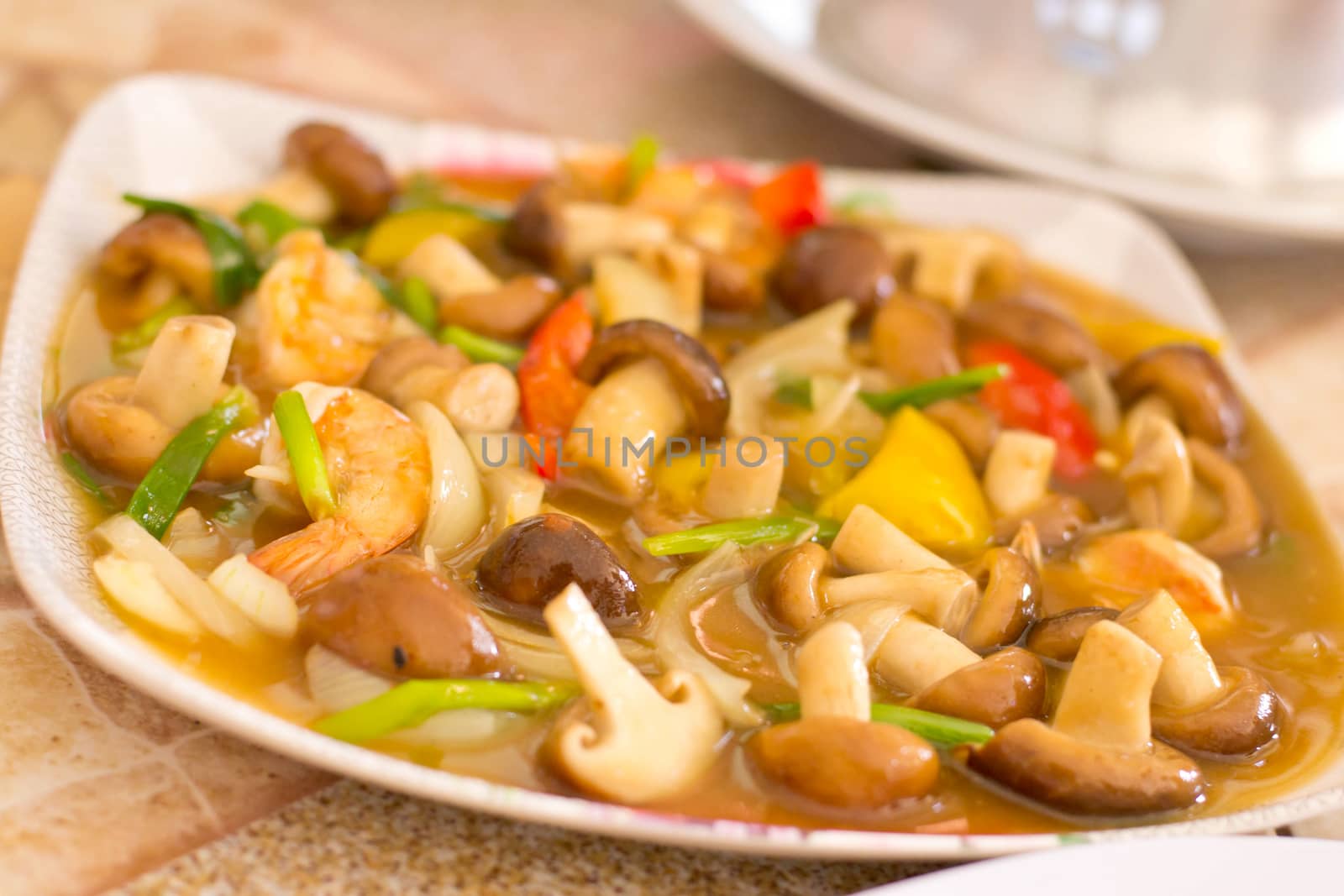 Closeup of Fried mushrooms in a plate by Thanamat