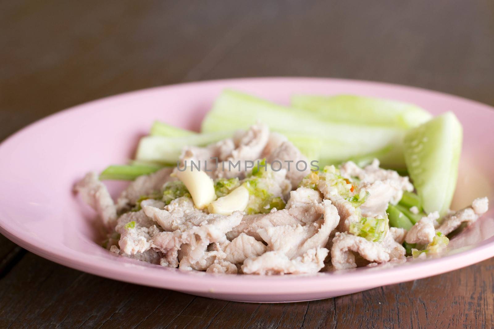 boiled pork with lime ,garlic (pork with lime) on the plate by Thanamat