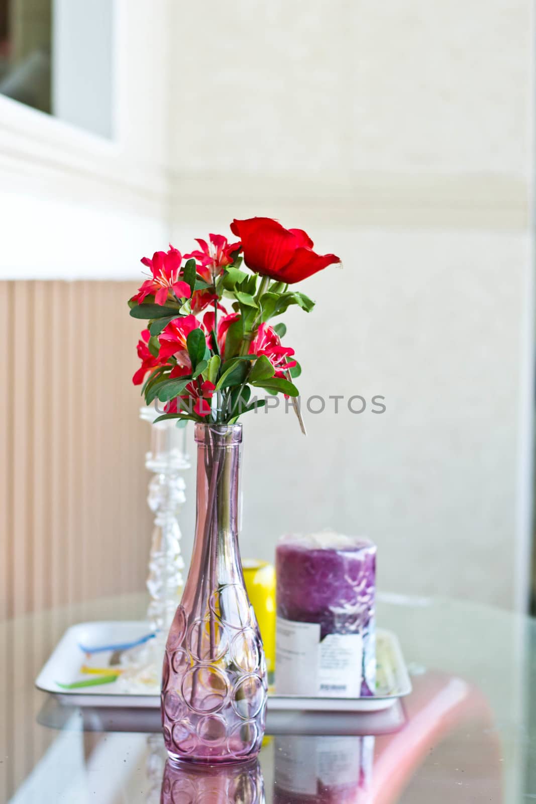 Flowers in a vase on the table by Thanamat