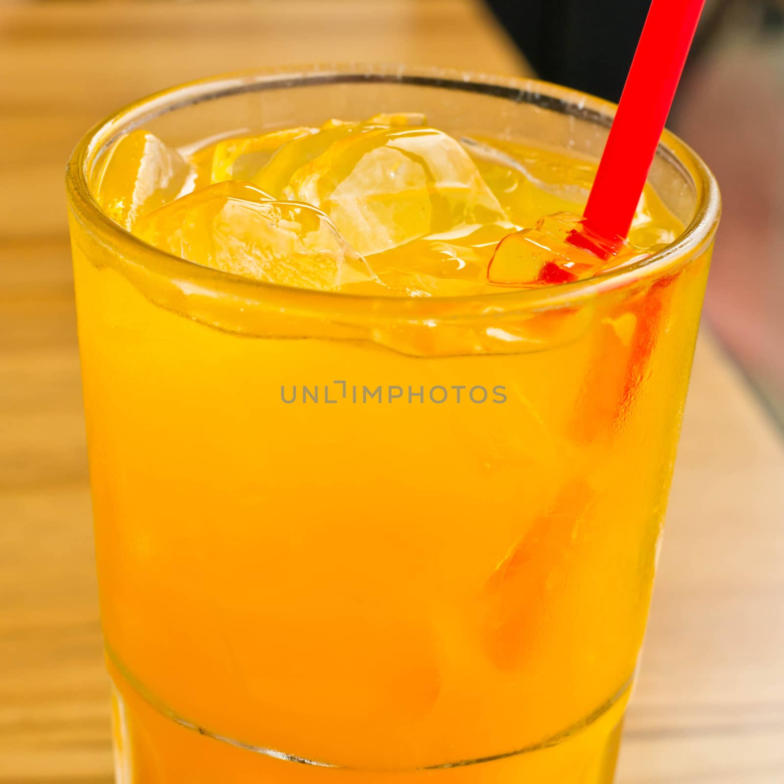 Orange juice with ice  in a glass place on the table 