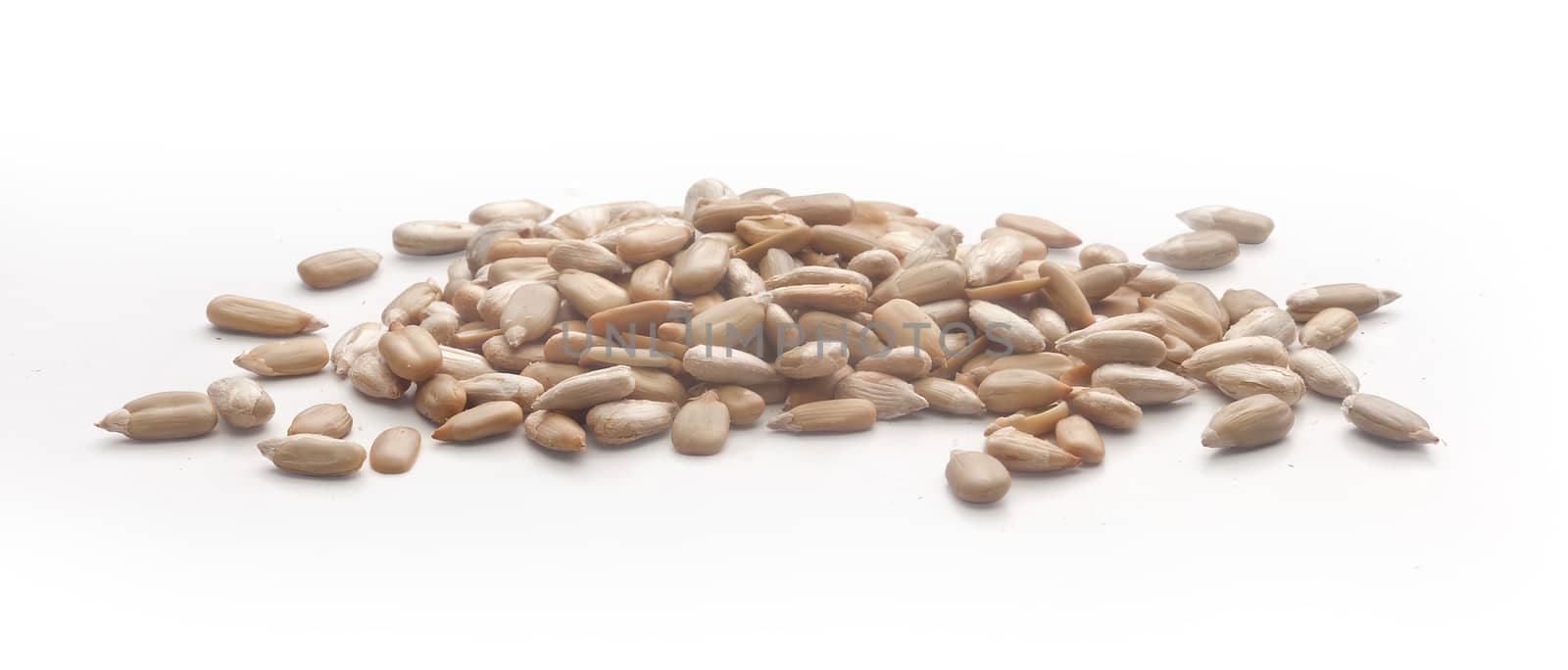 Isolated handful of sunflower's seeds without shell on the white background