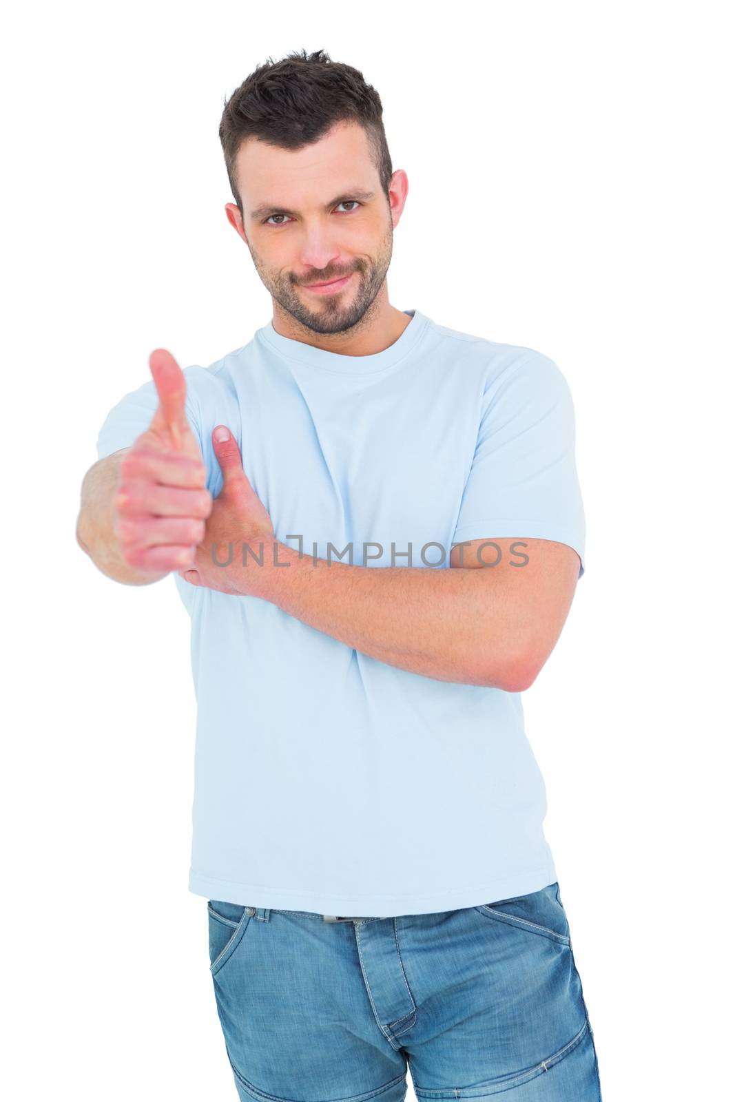Smiling man with thumbs up  by Wavebreakmedia