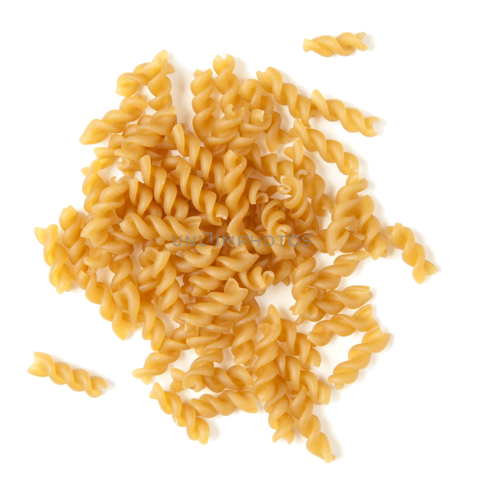 Fusilli pasta isolated against white background.