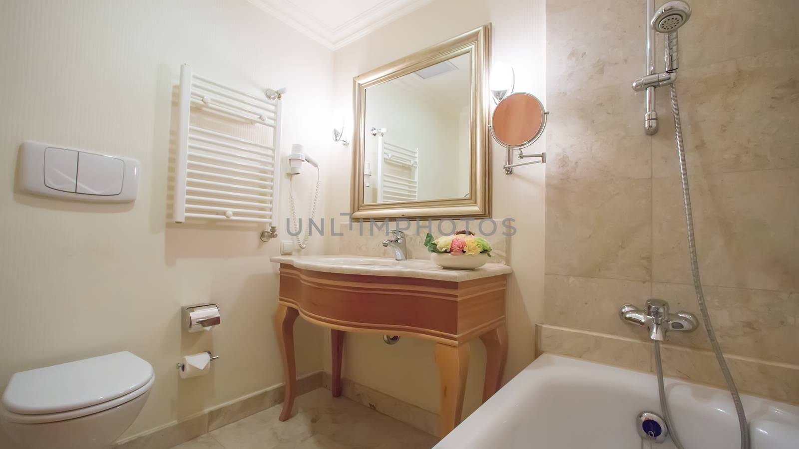 luxury bathroom interior complete with granite and beautiful tiled floors and walls.