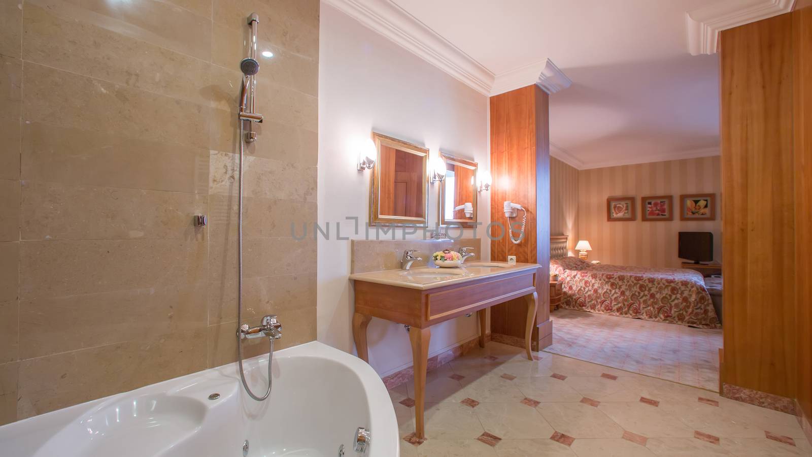 luxury bathroom interior complete with granite and beautiful tiled floors and walls.