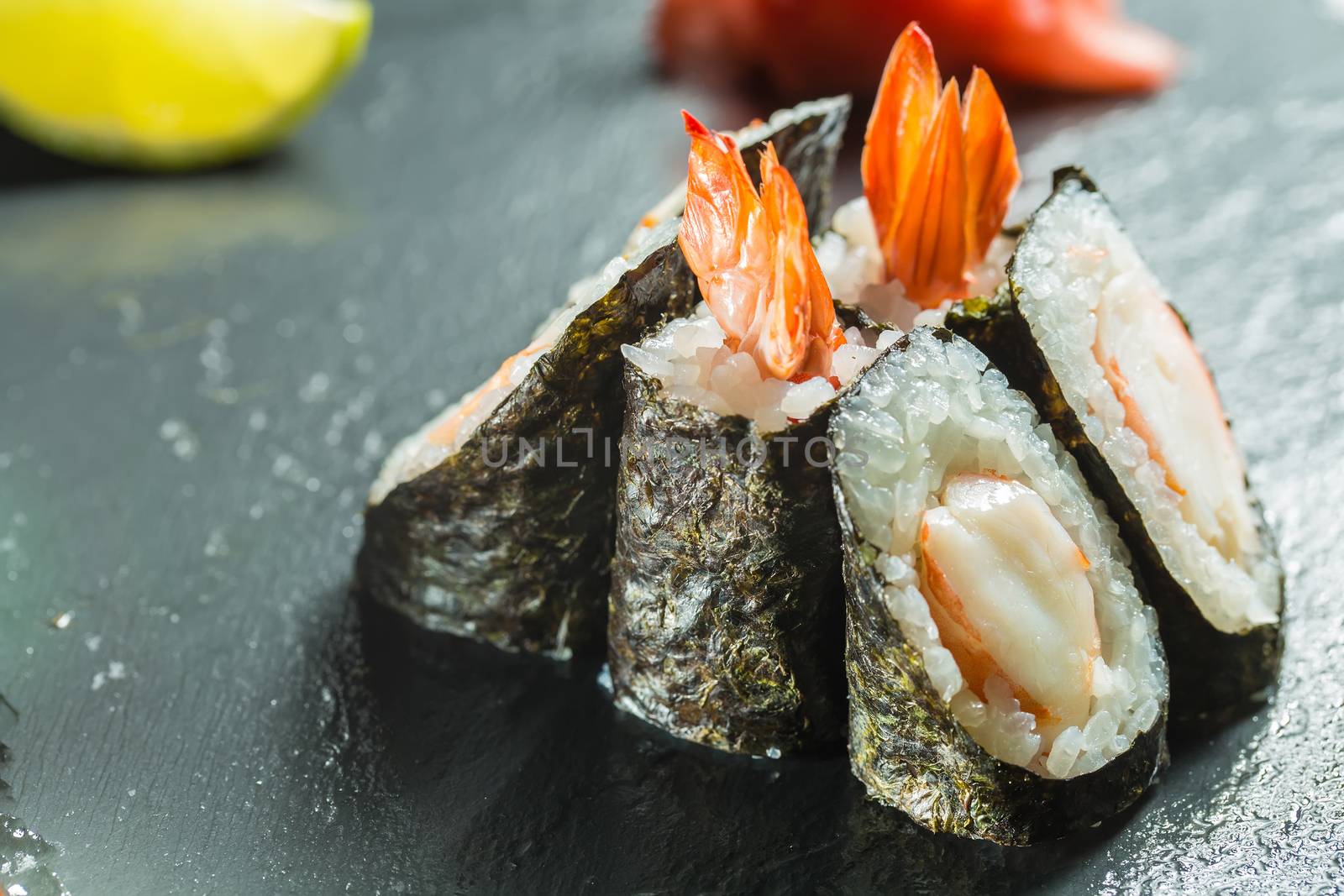 japanese cuisine. Rolls with shrimp on the black background