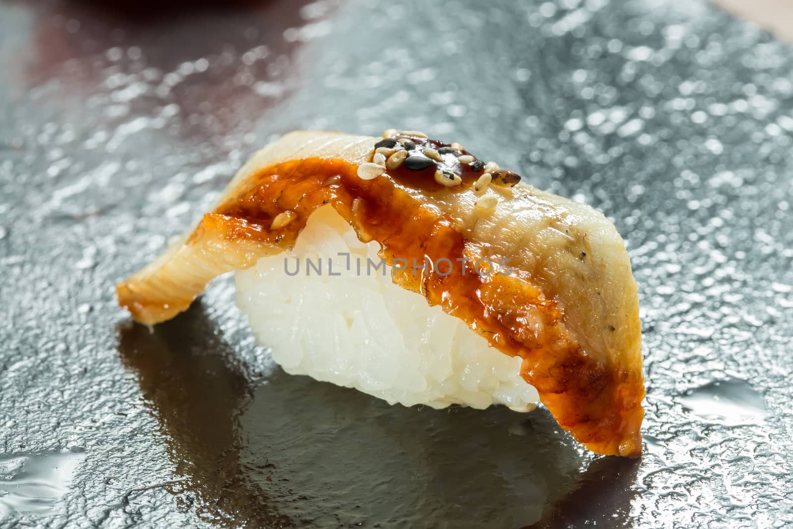 Organic Eel sushi nigiri on black background
